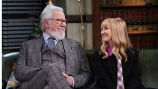 John Larroquette as Dan Fielding on a couch with Melissa Rauch as Abby Stone in Night Court Season 3
