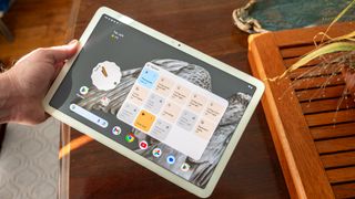 The Google Pixel Tablet with a smart home controls widget on the home screen