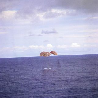 The Apollo 13 module pictured splashing down in Pacific Ocean.