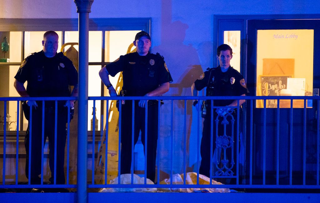 Tallahassee police officers are stationed outside the HotYoga Studio after a gunman killed one person and injured several others inside on November 2, 2018.