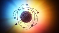 An illustration of an atom on a rainbow background, representing the world of quantum physics