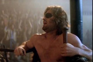 Escape from New York - Kurt Russellâ€™s Snake Plissken takes a breather during his Madison Square Garden bout with giant opponent Slag in John Carpenterâ€™s 1981 sci-fi classic.
