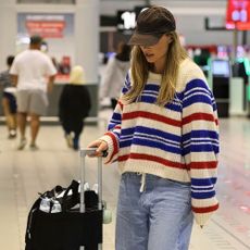 Margot Robbie wears drawstring jeans.