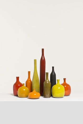 ten bud vases by Jacques Ruelland and Dani Ruelland, made from glazed pottery with manganese
