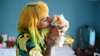 Woman and guinea pig