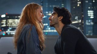 Blake Lively and Justin Baldoni talk on a city rooftop in 'It Ends With Us'