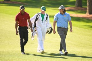 Tiger Woods and Neal Shipley walk together at Augusta National