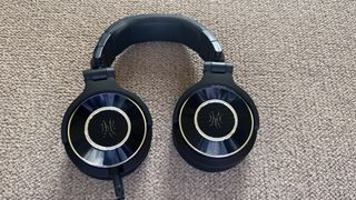 The OneOdio Monitor 60 Wired Headphones pictured on a carpeted surface