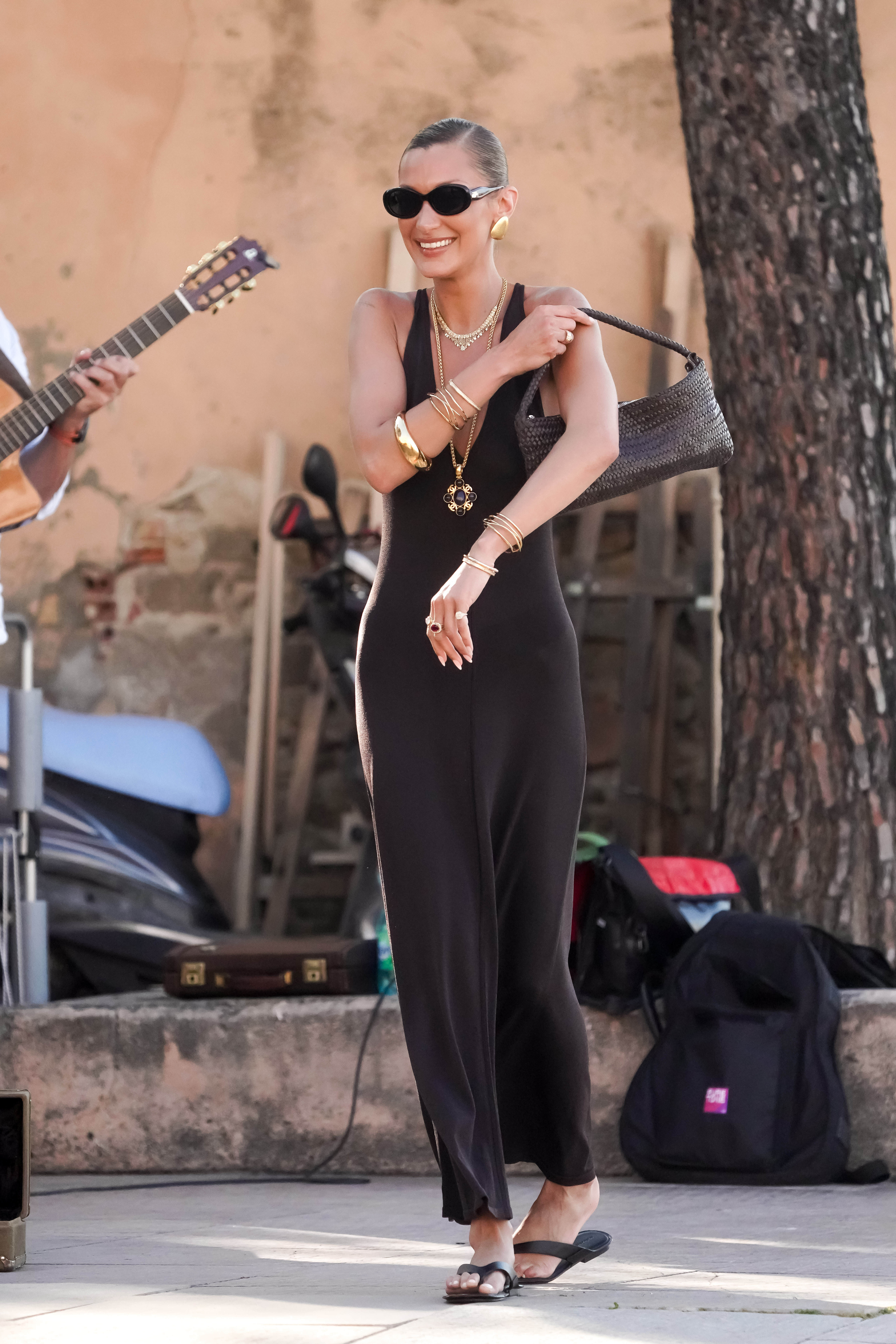 Bella Hadid Massimo Dutti brown dress, bag and flip flops