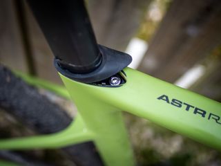 Detail photo of a green Ridley ASTR RS leaning against a wooden fence