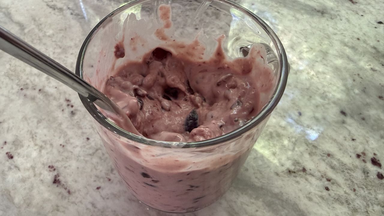 Ninja CrushBOSS making cherry frozen yogurt