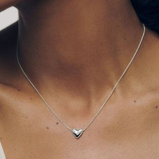 Image of woman wearing silver necklace 