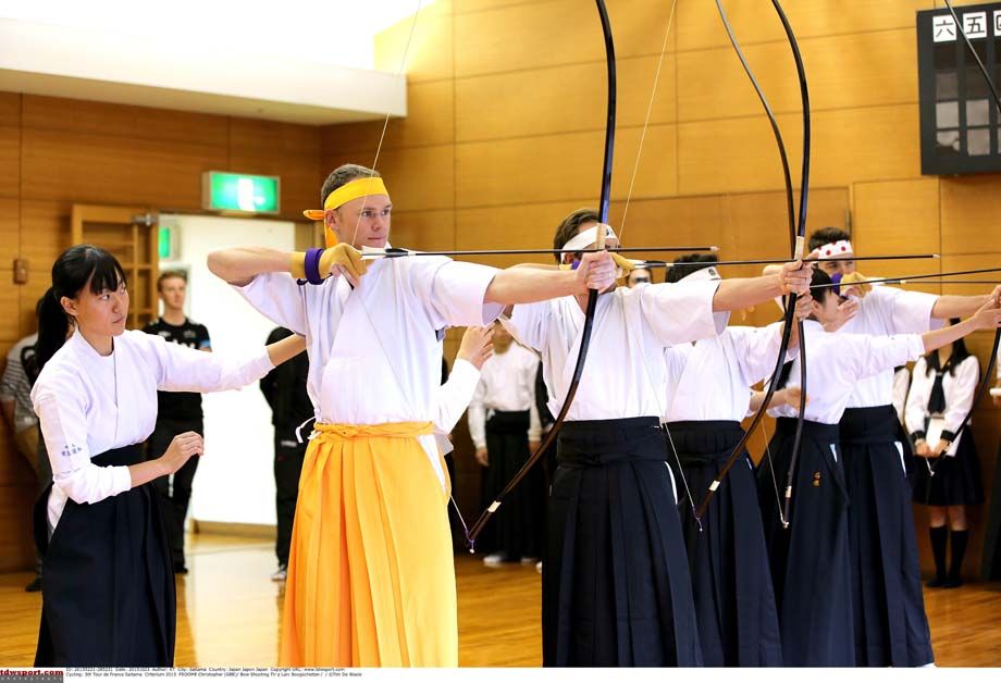 Riders take part in Japanese archery ahead of the Saitama Criterium