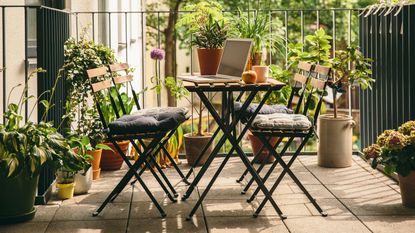 Prime Day patio furniture deals: Patio furniture on green balcony with lots of plants