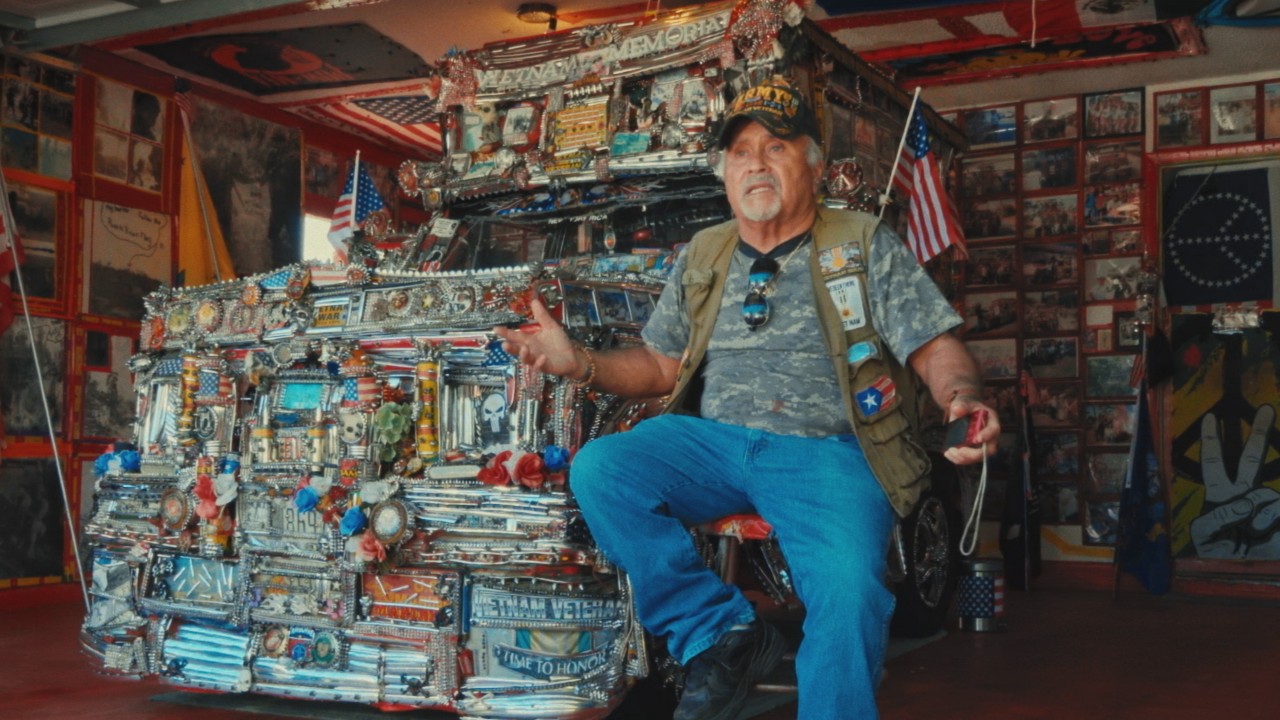 Man sitting by his truck