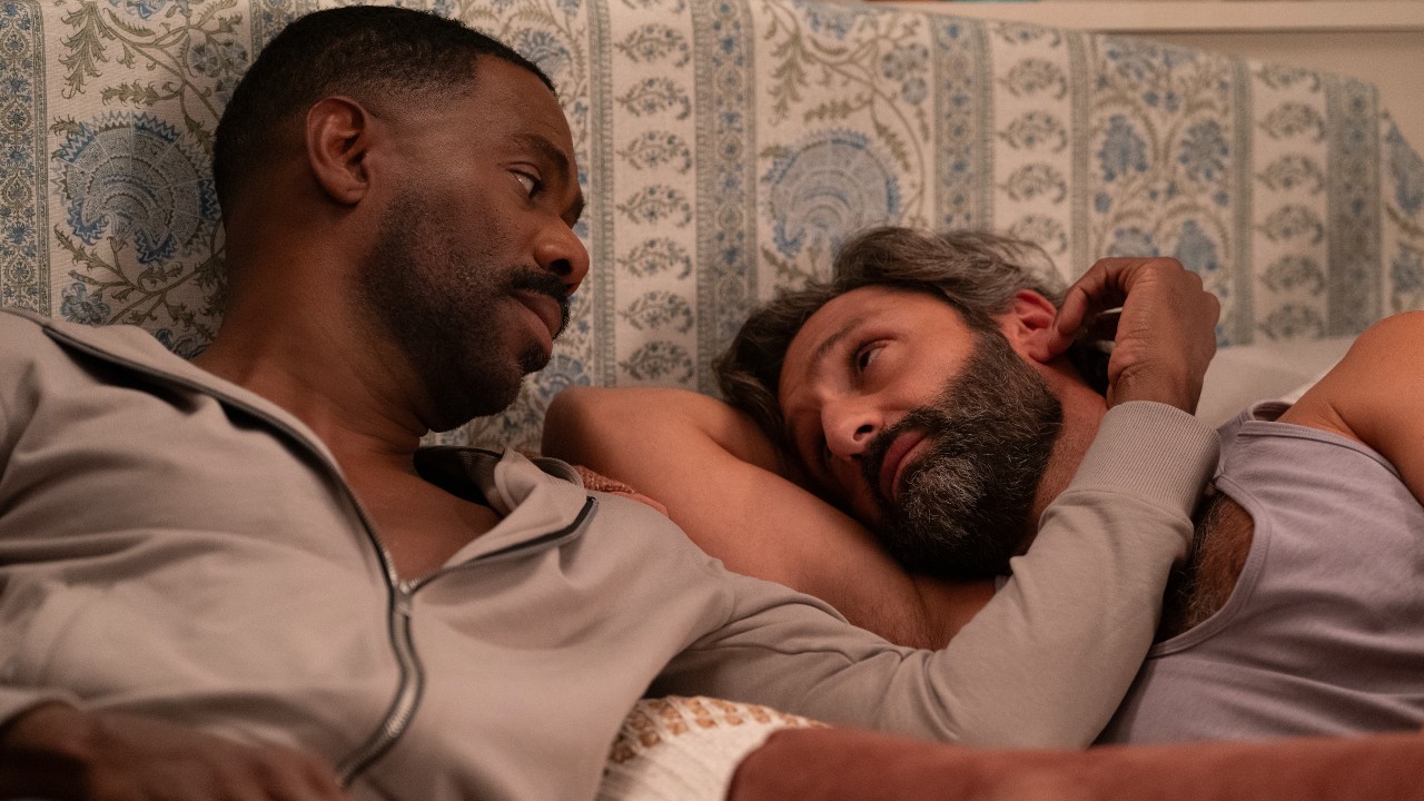 Danny and Claude lying in bed