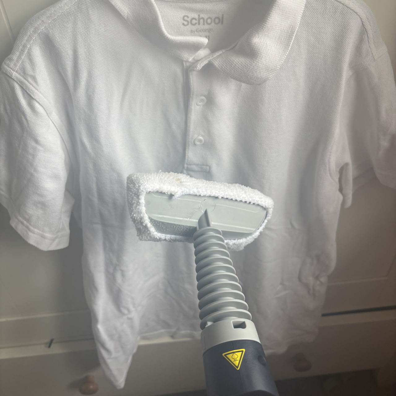 Using the Beldray Digital Handheld Steam Cleaner upholstery attachment to steam clothes