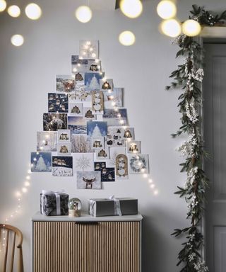 Christmas tree themes 2021 with an alternative christmas tree made from photos and string lights pinned to the wall