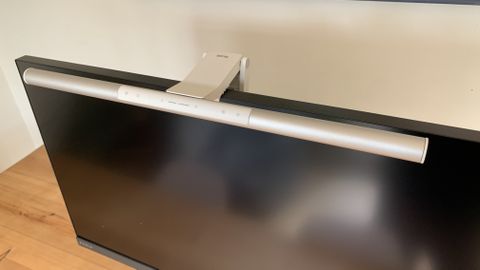 BenQ ScreenBar Pro attached to the top of a computer monitor