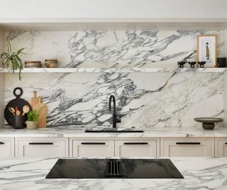 Marble kitchen with a cooktop on the island