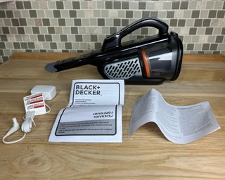 Black and Decker Dustbuster handheld vacuum with instrucion manual and accessories