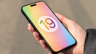 A render of the iOS 19 logo on an iPhone