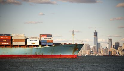 A container ship leaves New York.
