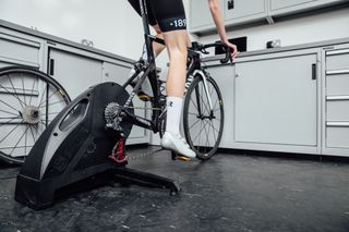 Image shows a rider learning how to cycle with clipless pedals.