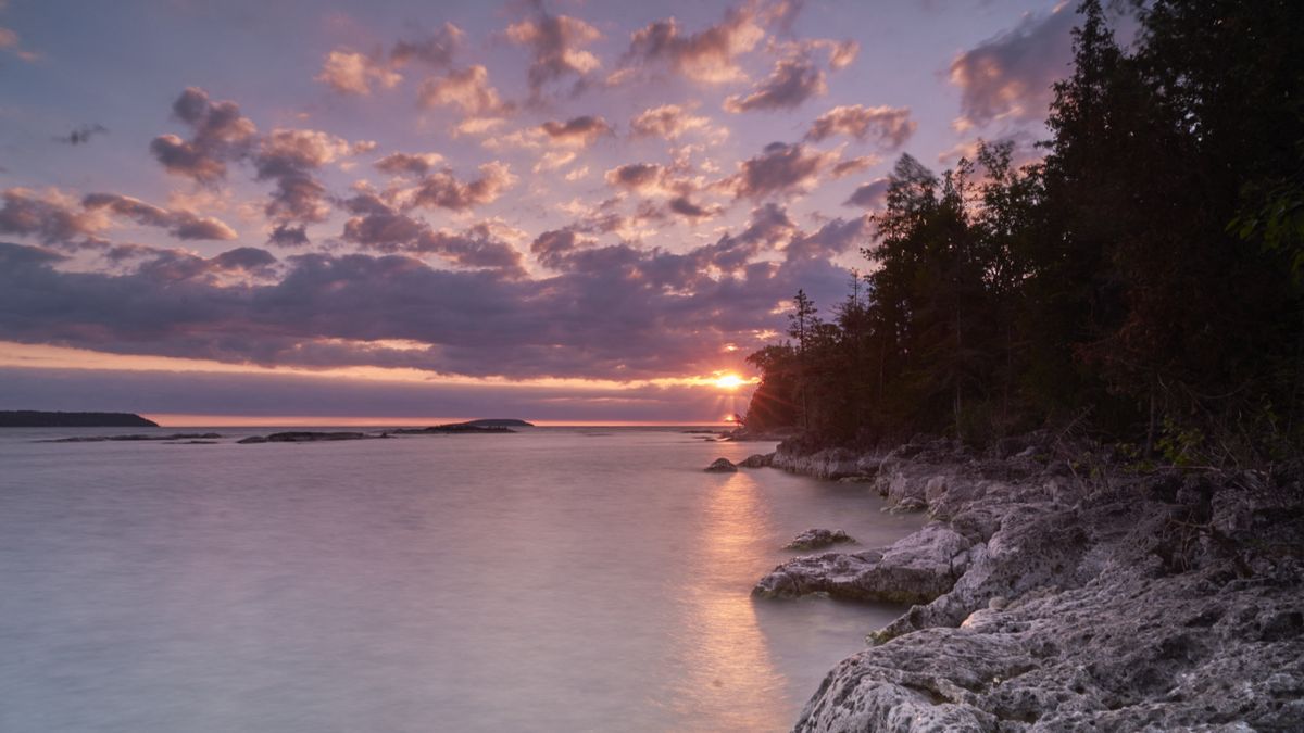 The eclipsed sun shimmers off Fathom Five National Marine Park in Ontario on June 10, 2021, as photographed by Geoff Robins.