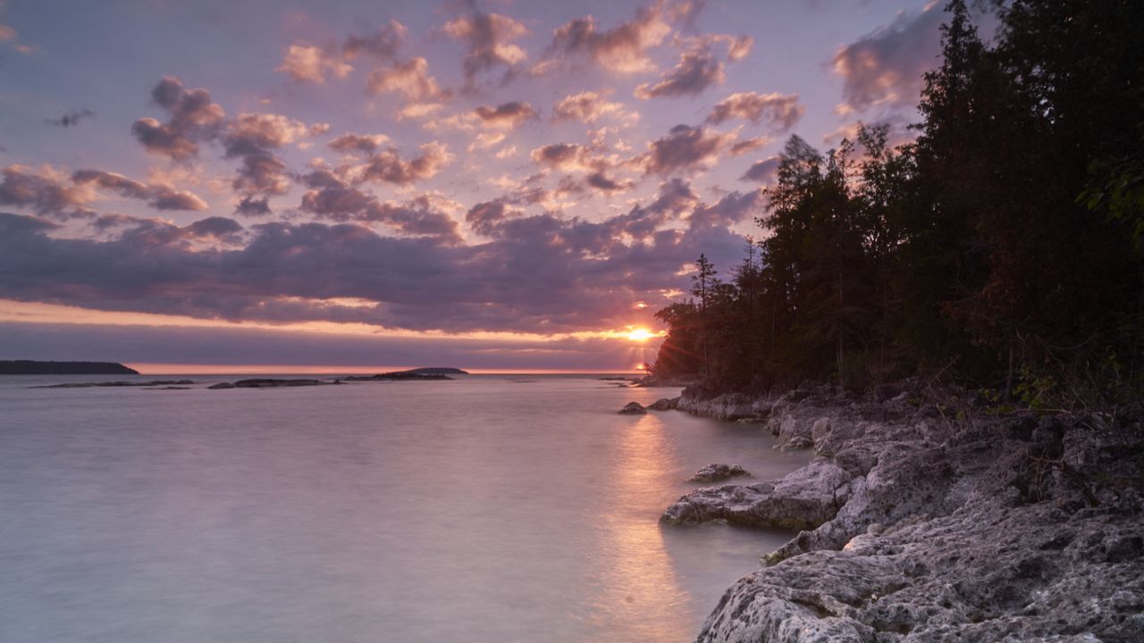The eclipsed sun shimmers off Fathom Five National Marine Park in Ontario on June 10, 2021, as photographed by Geoff Robins.