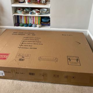 Box of DUSK Hudson sofa bed on floor