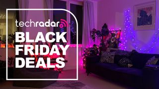 Philips Hue Festavia lights in living room with text 'TechRadar Black Friday Deals'