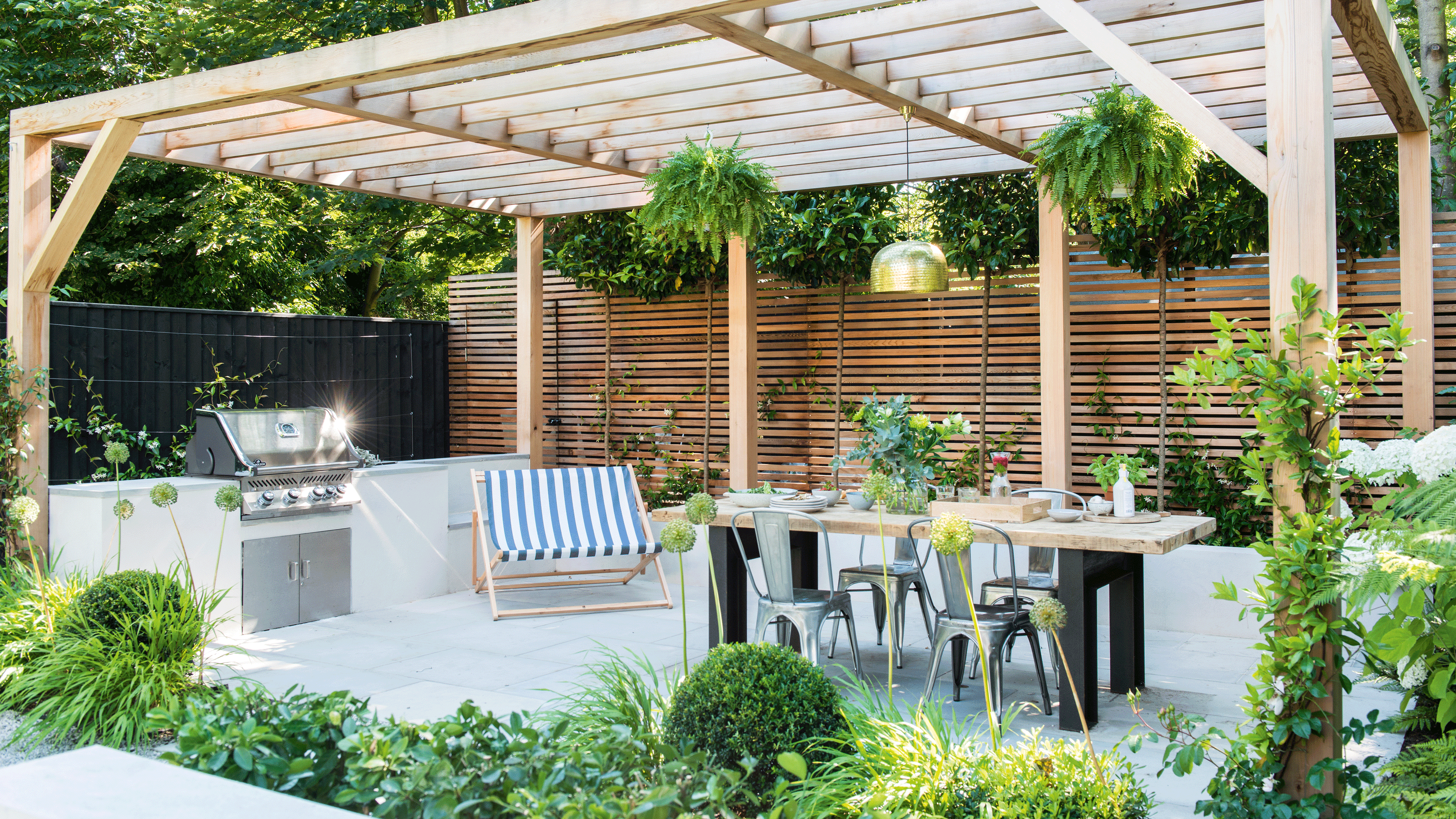 Pergola over a large patio with BBQ