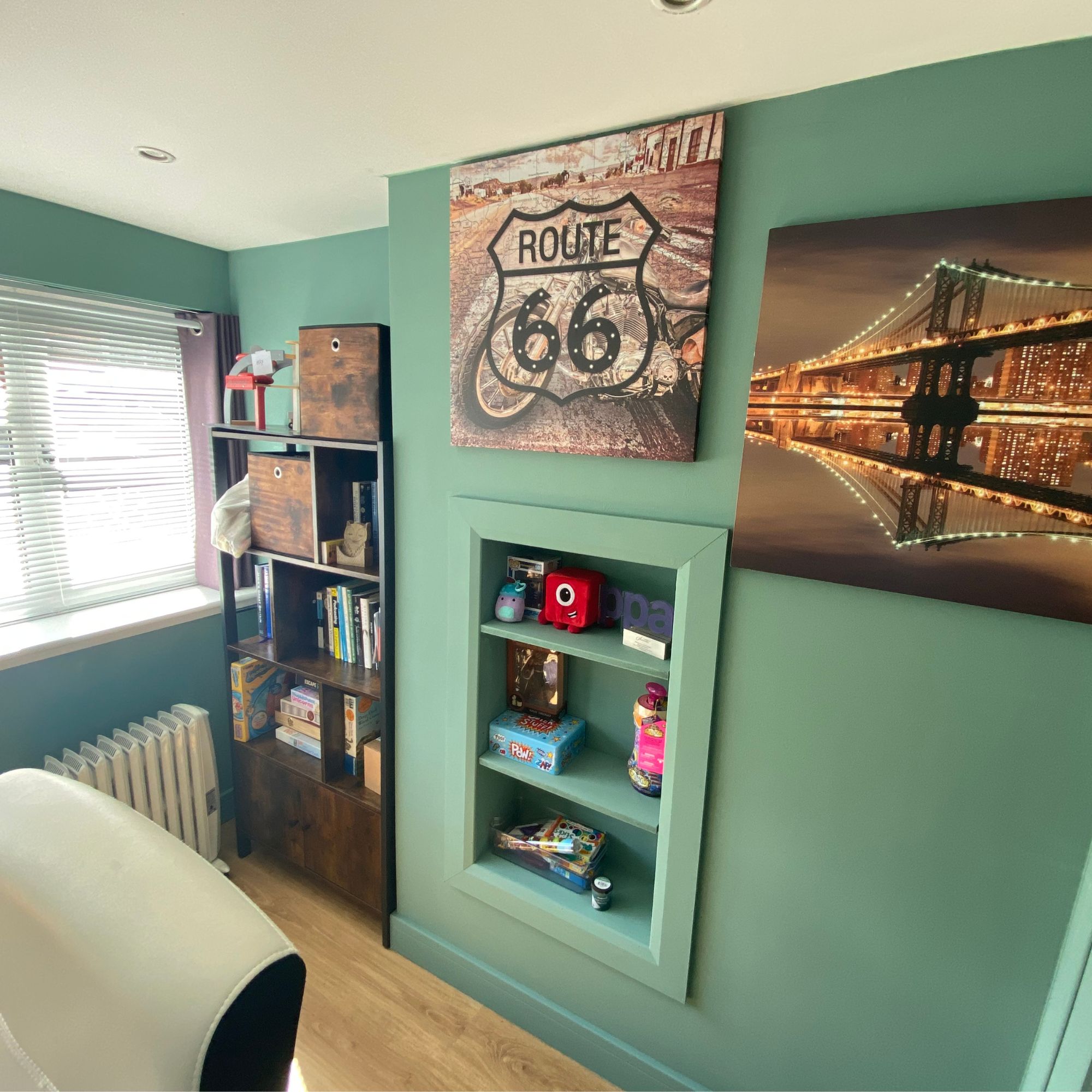 Canvas prints cover the panels to access the gas ands electric meters in a home office in a converted garage
