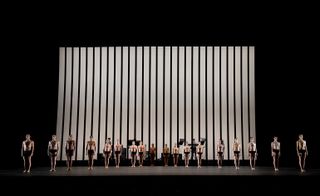 Line of ballet dancers on stage