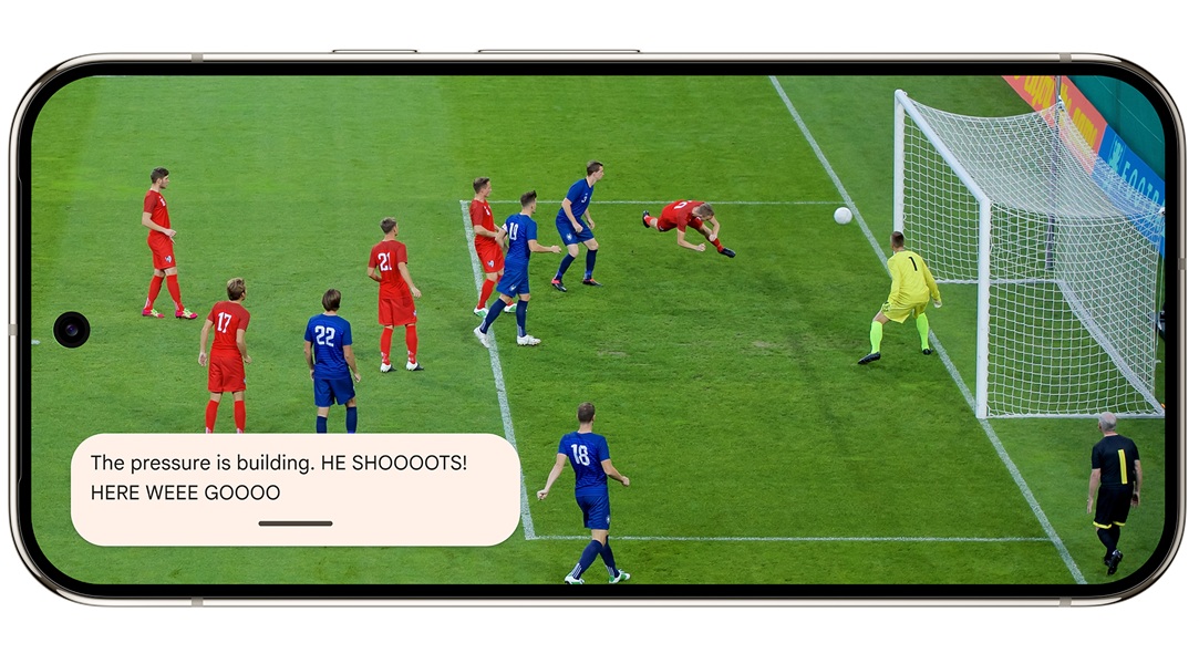 Google's new "Expressive Captions" delivers a powerful "HE SHOOOTS!" as a user watches a soccer game.