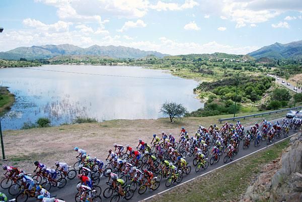 ISD is noticeable in its neon green livery as the peloton passes one of the lakes outside San Luis.