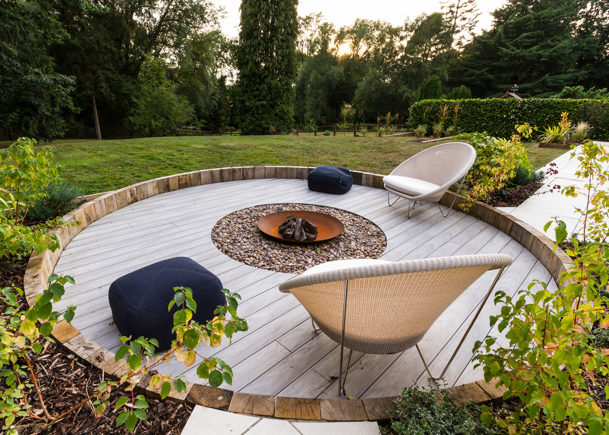 circular deck with fire pit and garden chairs