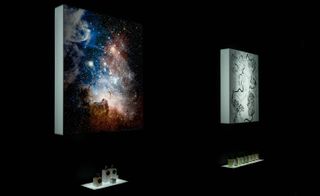 Canvases in black room