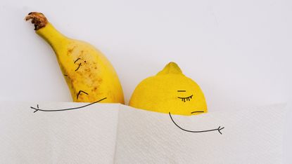 fruit depicted as selfish partners in bed; angry banana and lemon