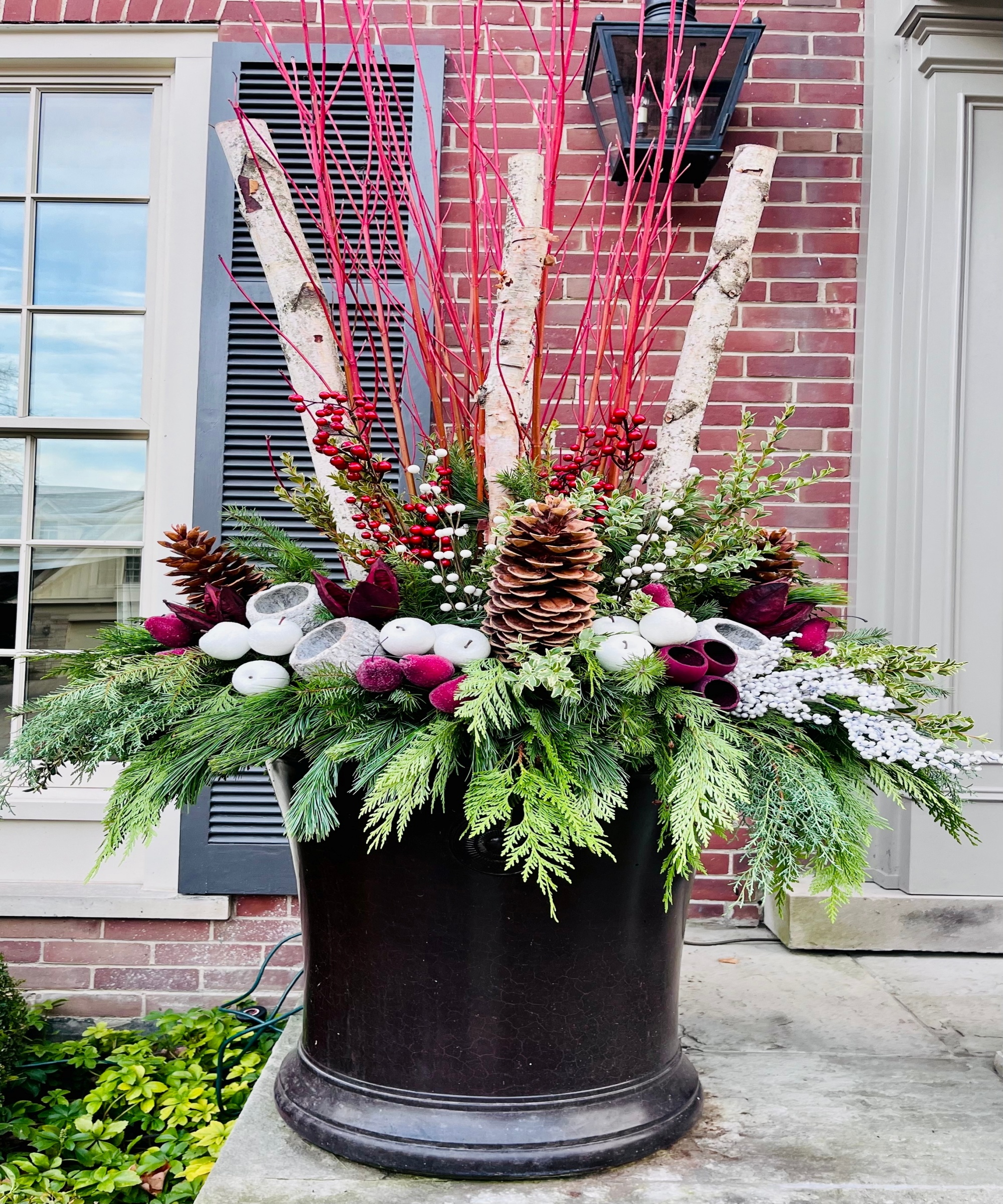 Festive high-density plastic container outside a front doot