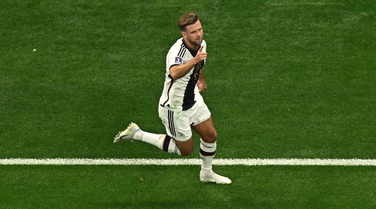 Germany striker Niclas Fullkrug celebrates after scoring his team&#039;s first goal during the Qatar 2022 World Cup Group E football match between Spain and Germany at the Al-Bayt Stadium in Al Khor, north of Doha on 27 November, 2022.