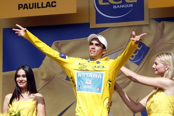 Alberto Contador pulls on another yellow jersey