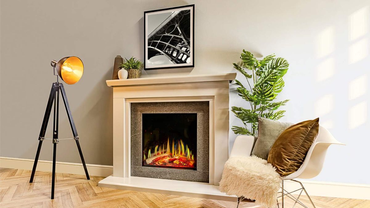 Neutral room with central fireplace featuring an electric fire from Charlton &amp; Jenrick. The room is dressed with a seat, large plant and a floorstanding lamp.