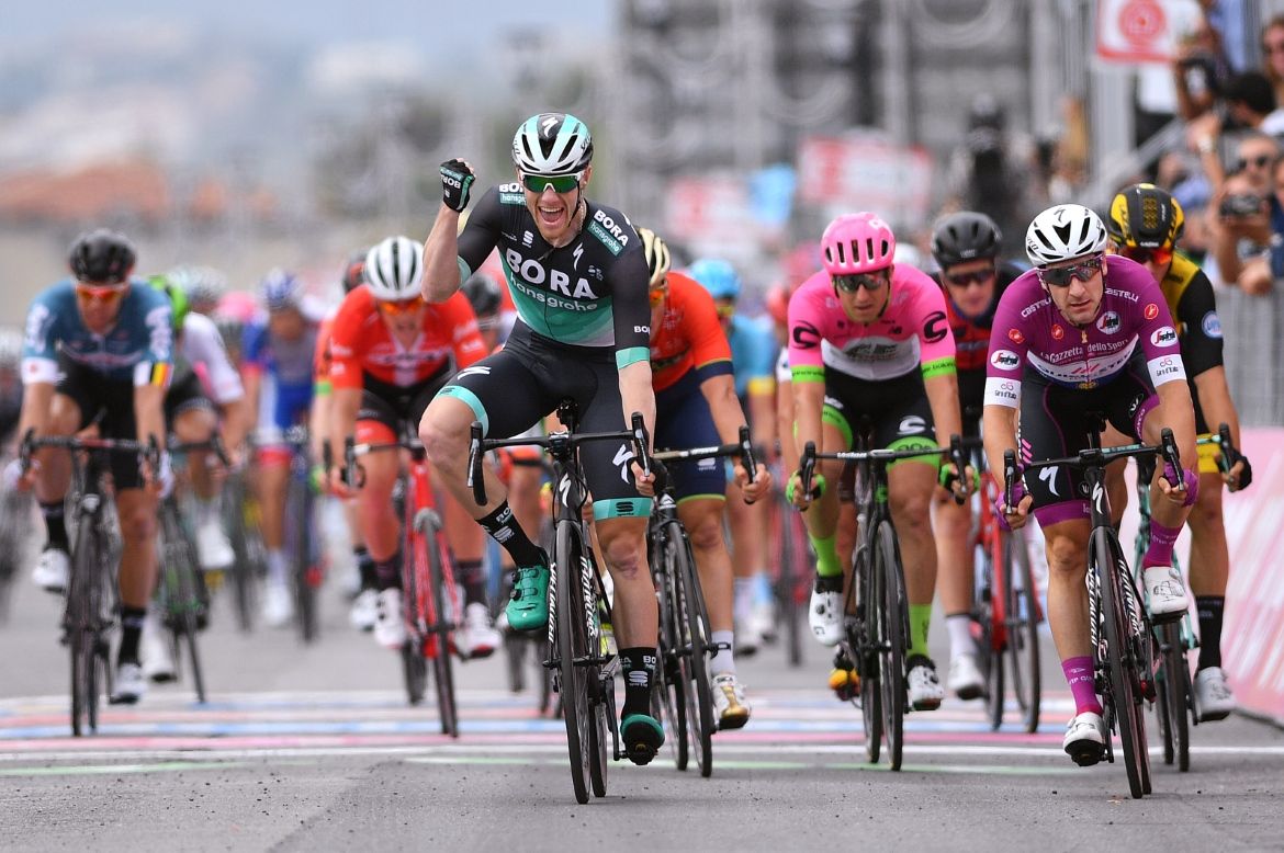 Sam Bennett punches the air having claimed his first Grand Tour win