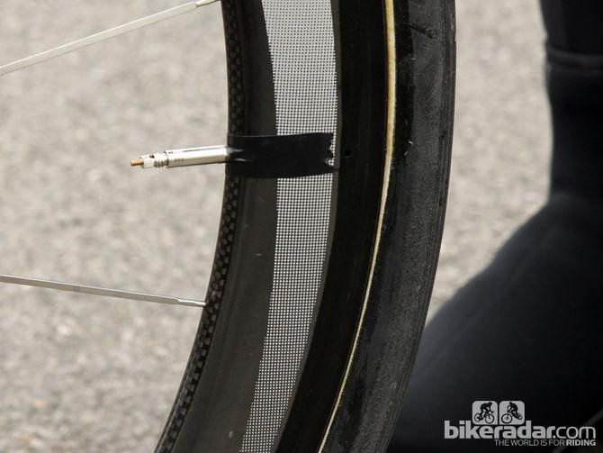 A strip of tape keeps the valve stem from rattling inside the rim