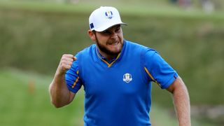 Tyrrell Hatton celebrates making a putt at the 2021 Ryder Cup