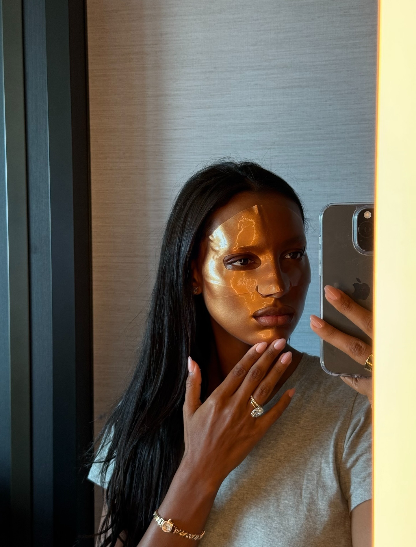 Jasmine Tookes wearing a copper sheet mask