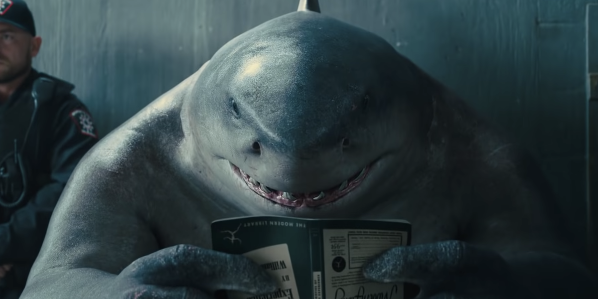 King Shark reading a book