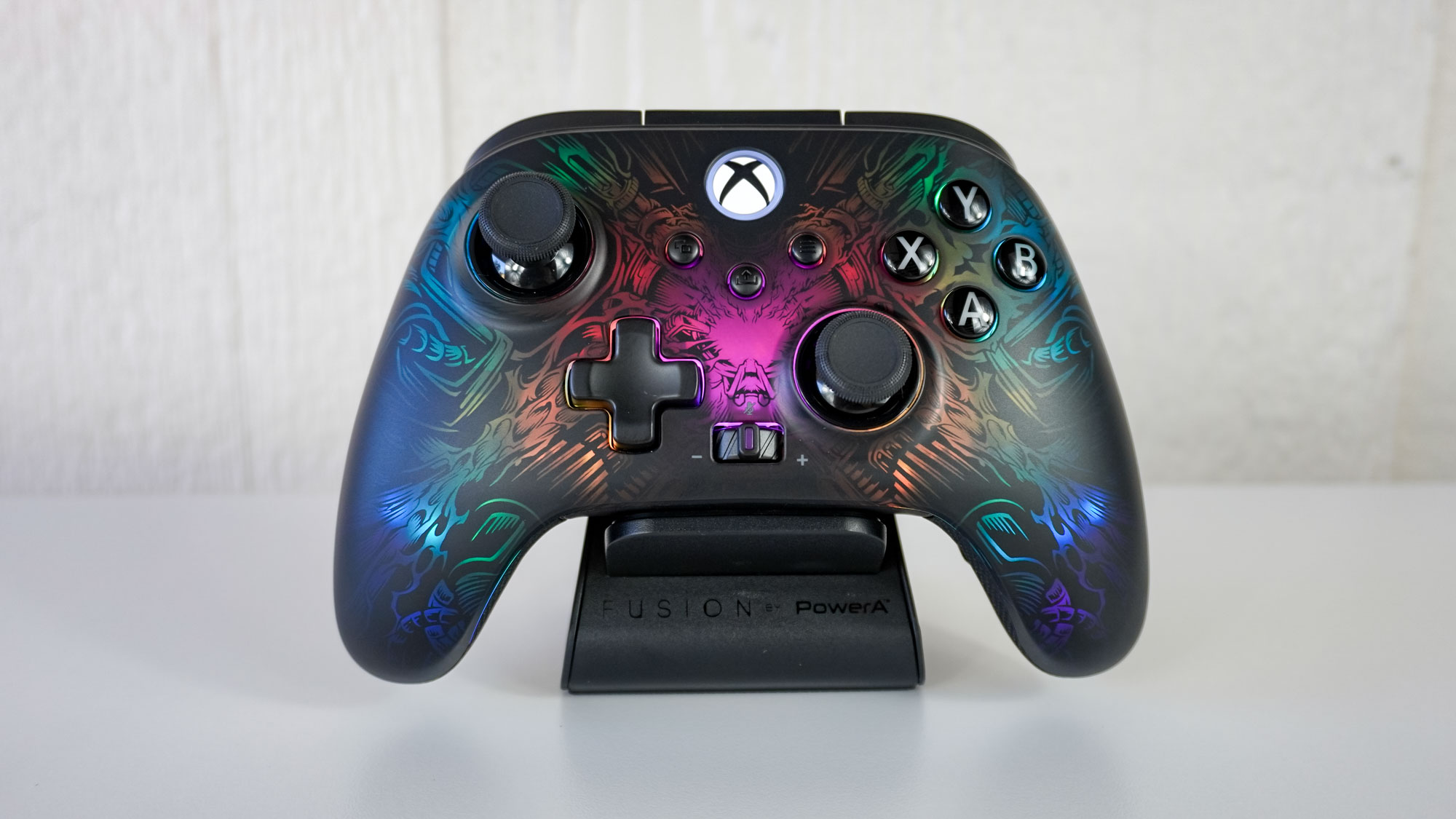 The PowerA Fusion Pro Wireless Controller on its magnetic charging stand with its RGB lighting enabled